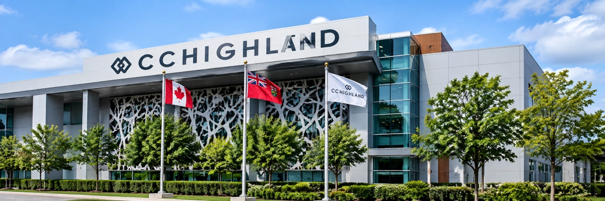 Cchighland headquarters in Charlotte, with its glass windows, pillars, and text on the building, surrounded by flags